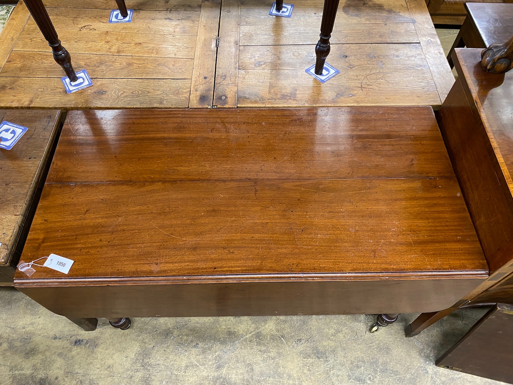 An early Victorian mahogany drop leaf extending dining table length 168cm extended, one spare leaf, depth 122cm, height 74cm